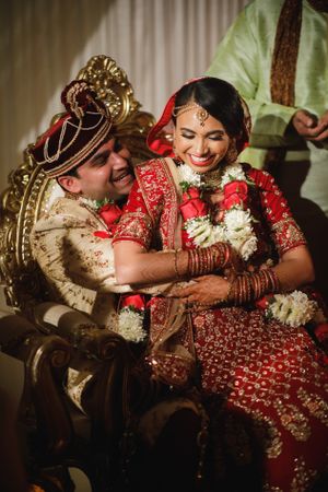 Emotional wedding moment at The Marigold in NJ as the bride and groom embrace during their traditional South Asian ceremony.