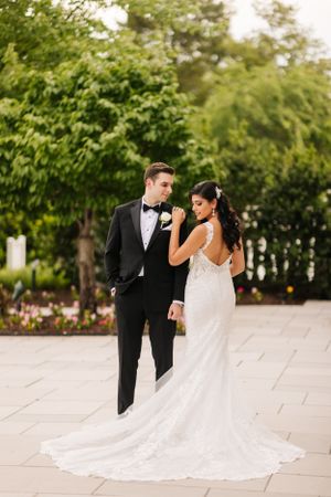 Elegant wedding couple shares a quiet moment outdoors at The Palace at Somerset Park—timeless romance captured in golden light.