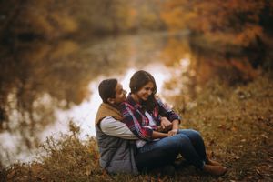 Cozy fall engagement session in Princeton, NJ with golden foliage and romantic lakeside cuddles—perfect for autumn couples photography.