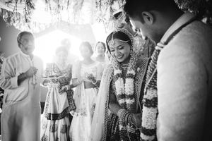 Emotional South Asian wedding ceremony at Chateau Bu-De, Dover DE, as the bride and groom exchange vows surrounded by family.