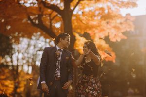 Fall engagement photo in Princeton with golden foliage, capturing romantic moments in warm autumn sunlight. Perfect for save-the-dates.