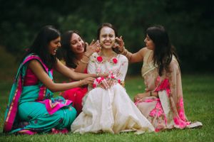 Bride and bridesmaids in floral Haldi attire at Hyatt Regency Chesapeake Bay, sharing laughs during a joyful pre-wedding celebration.