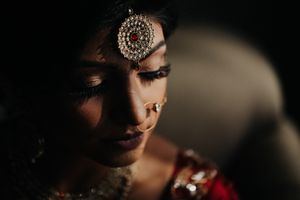 Dramatic bridal portrait at Conservatory Mansion captures the beauty and emotion of an Indian wedding in timeless low light.