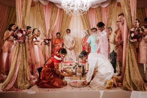 Traditional South Asian wedding ceremony at Springfield Country Club, with rituals performed under an elegant mandap surrounded by family.