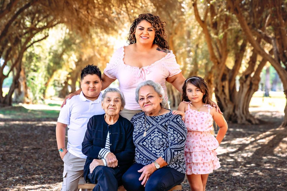 Great grandma and grandma, mom, and kids bonding during a Clovis outdoor family photo session