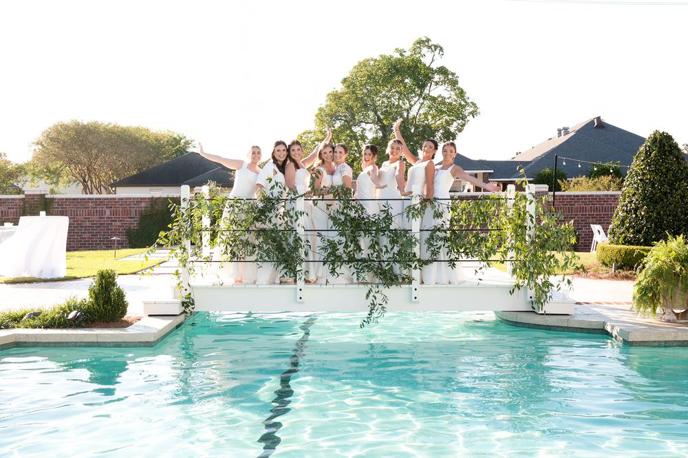 Swimming pool and outdoor venue decorated for an elegant wedding reception.