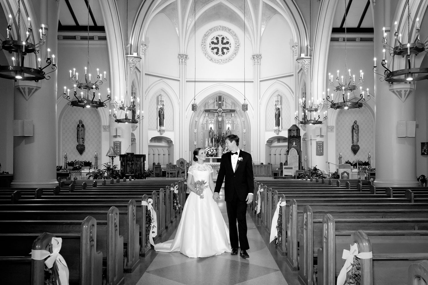 Black and white photographs of a traditional church wedding ceremony with classic architectural details.