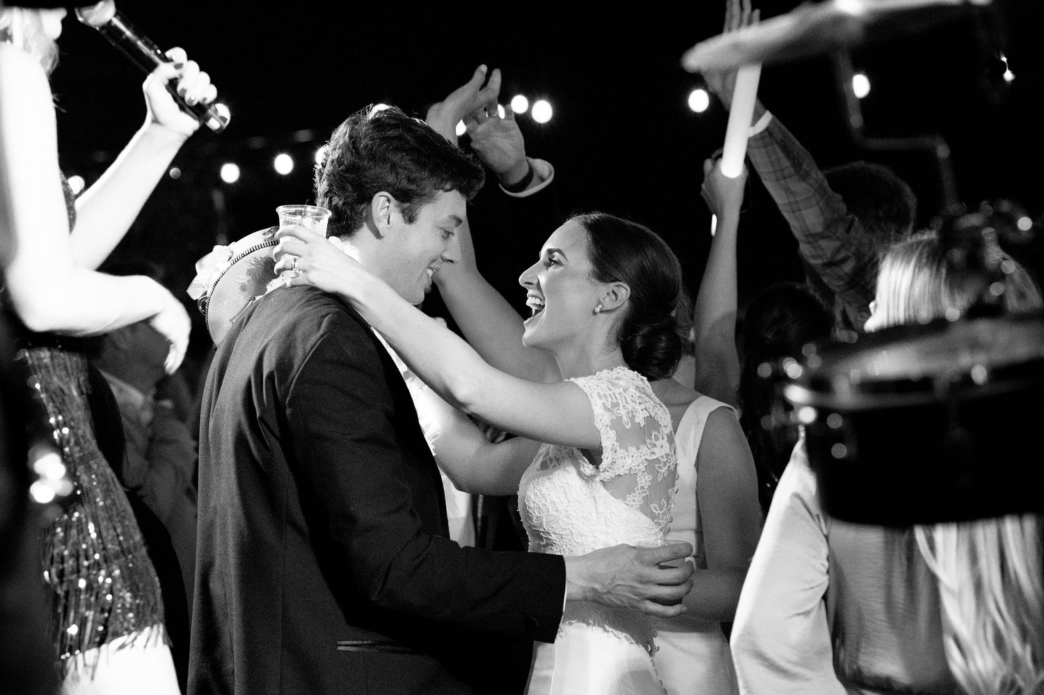 Black and white photos of wedding reception dancing and celebrations.