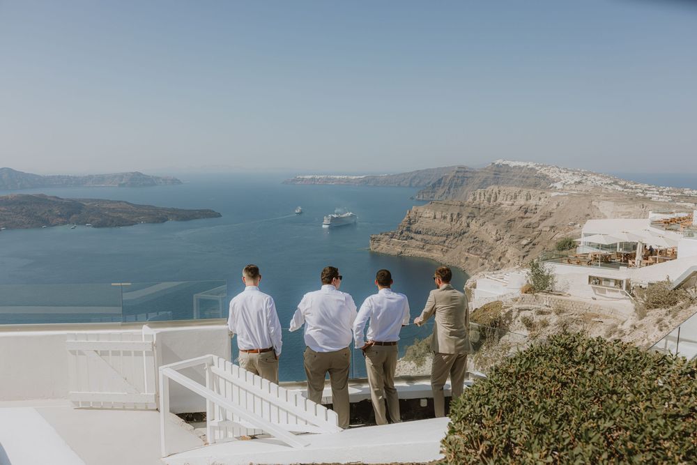 Stunning coastal view of Santorini with white buildings and blue sea in the background.
