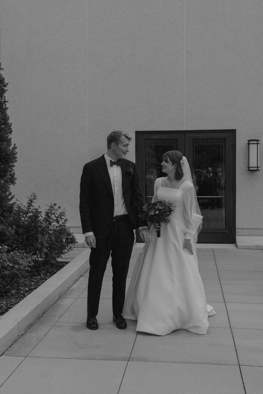 A black and white sequence of wedding photos showing a couple on a patio.