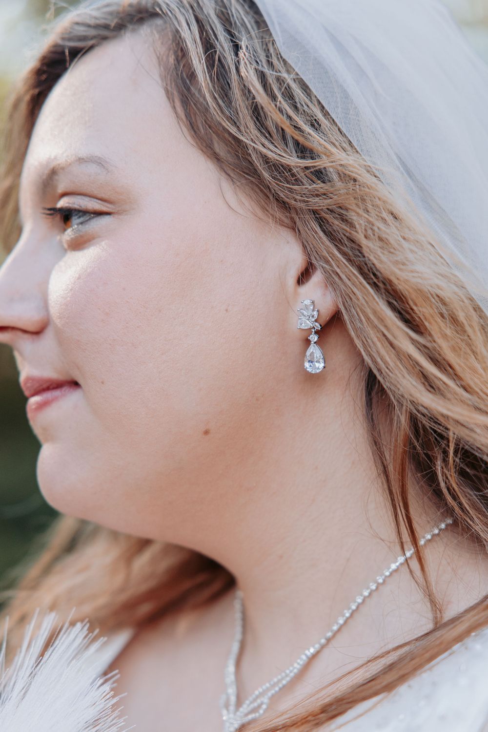 Close-up shots of elegant pearl and crystal bridal jewelry with a delicate design.