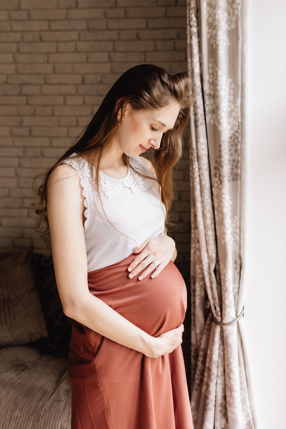 Mother to be in window