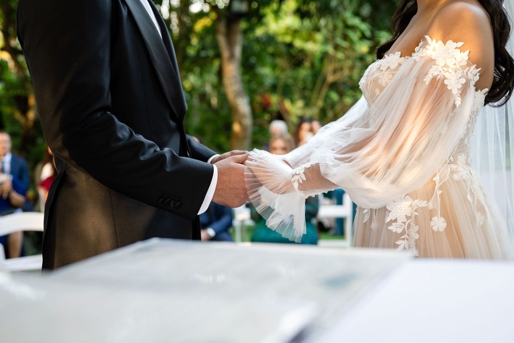 Flowing white wedding dress captured in motion during outdoor photography session.