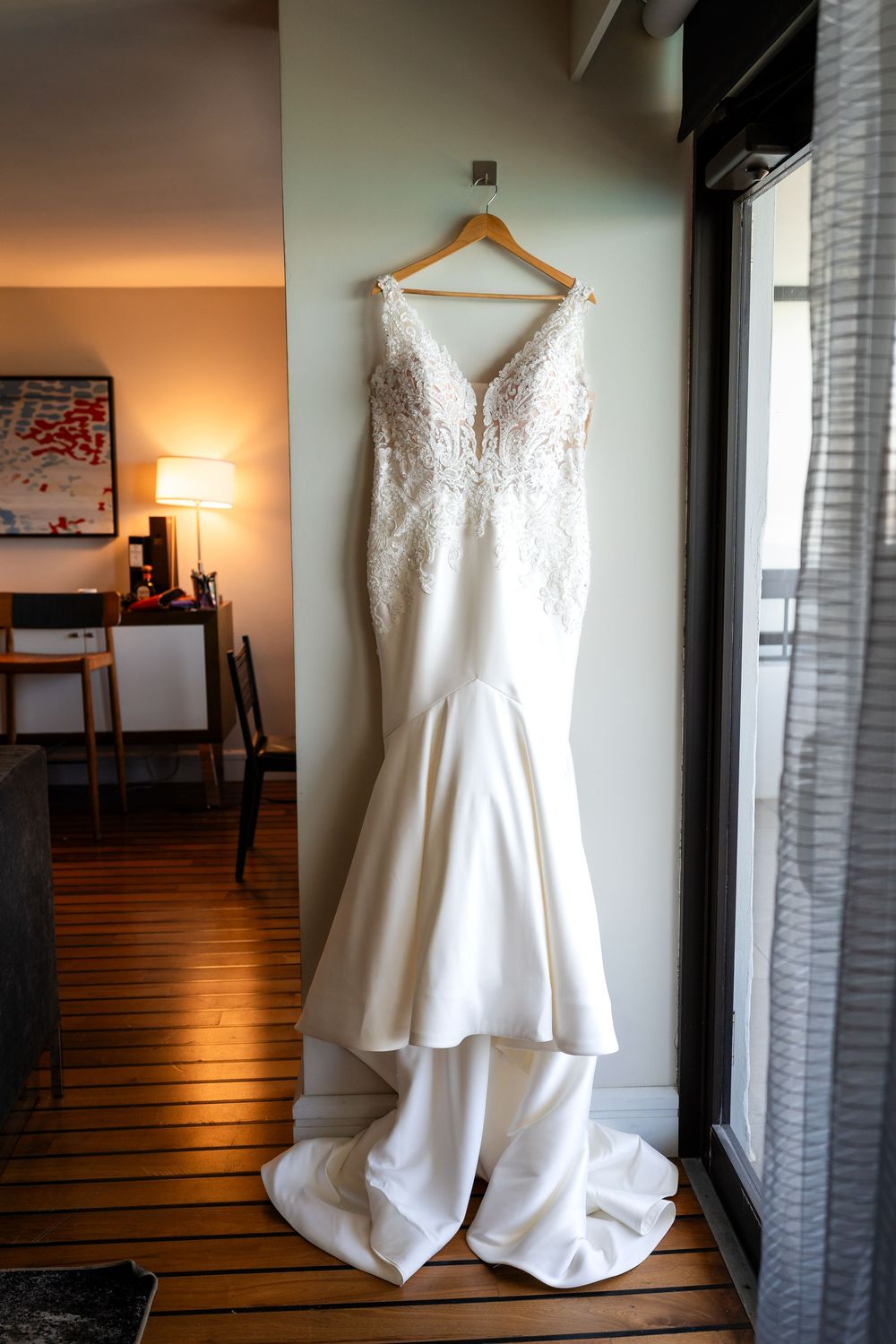 White wedding dress hanging in sequence showing different angles and details.