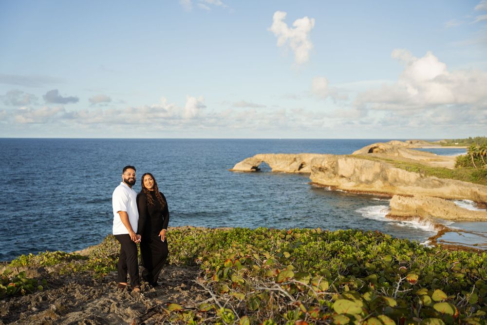Coastal landscape views of rugged ocean cliffs and scenic shoreline during a bright sunny day with blue skies.