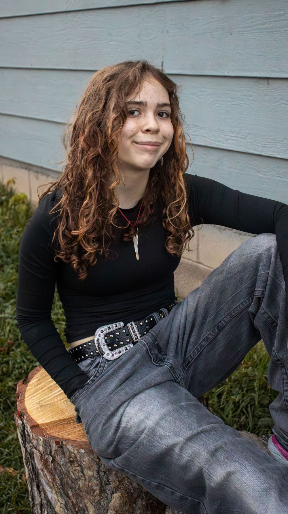 Teen girl smiling during a natural lifestyle senior photography session