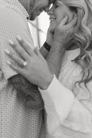 Intimate black and white close-up of a tender moment.