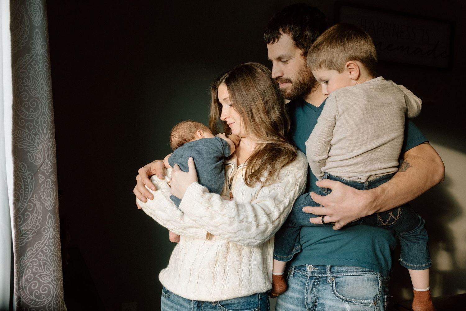 Tender family moments captured against a dark background.