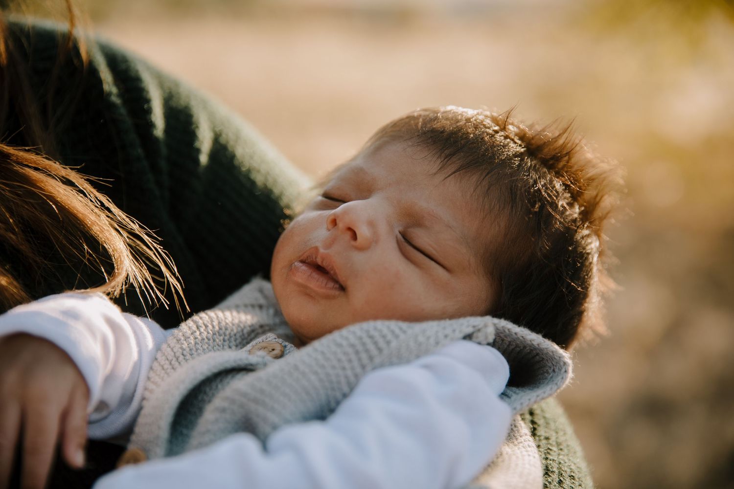 Candid family moments captured in golden sunlight outdoors.