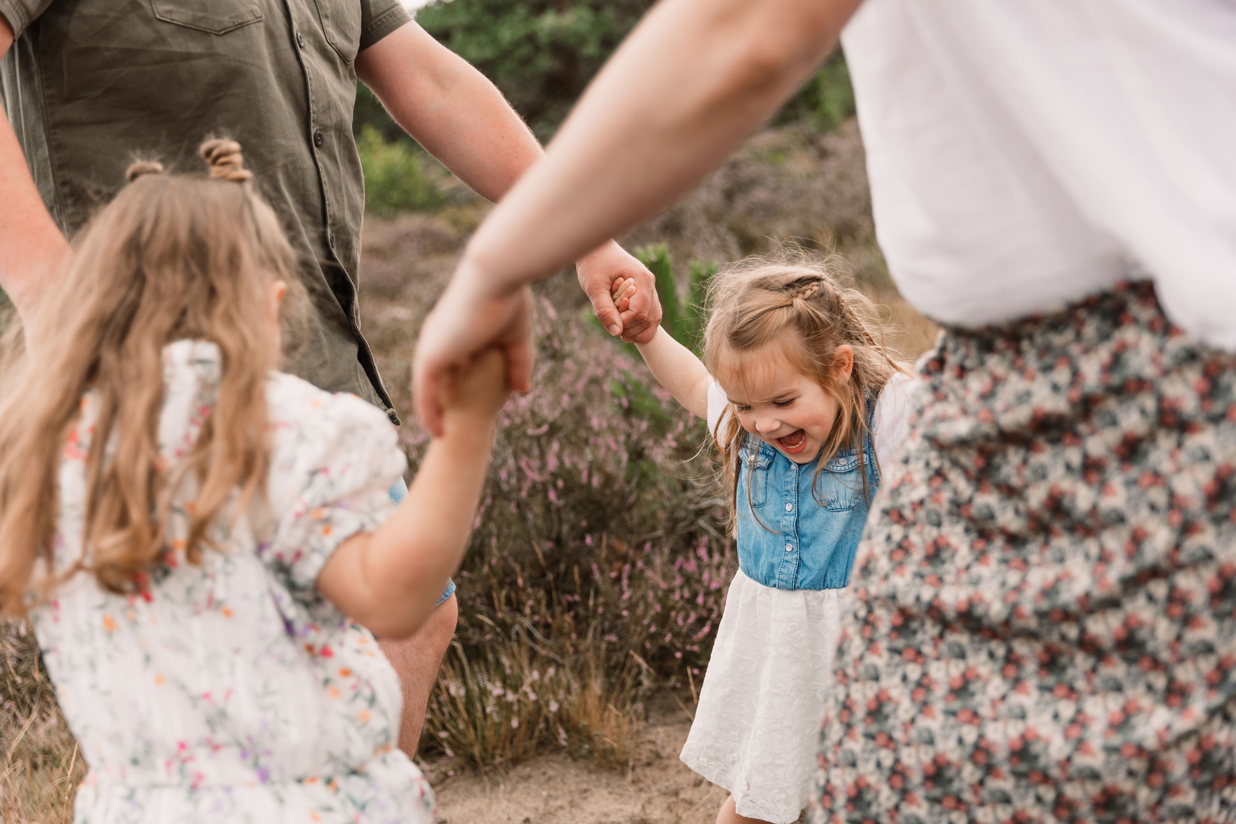 Candid lifestyle photography showing hands and casual interactions outdoors.