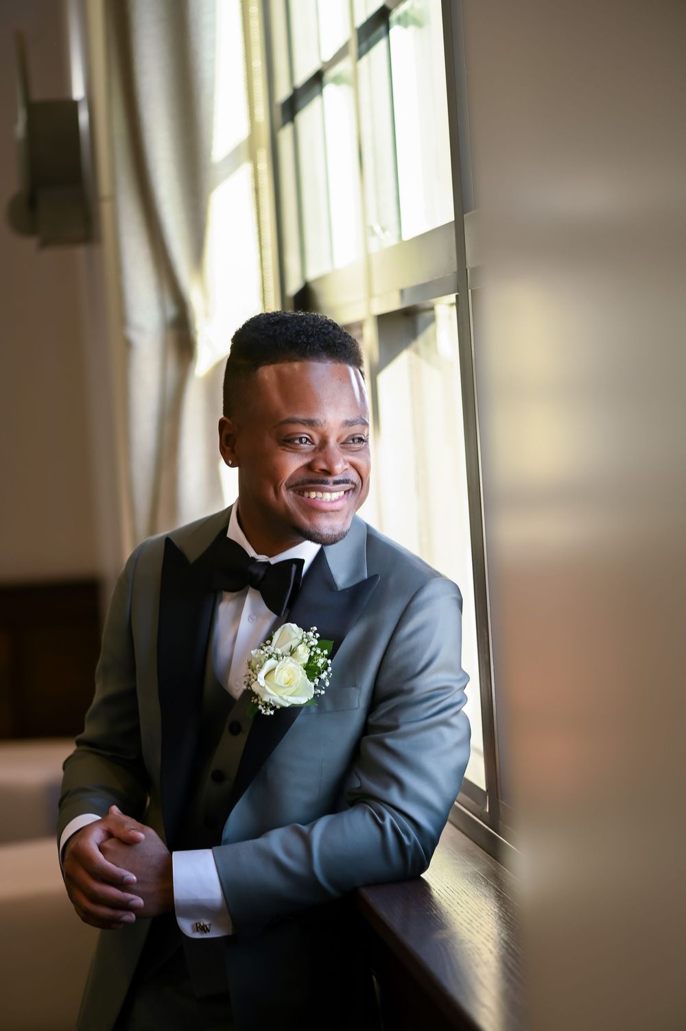At GatsbyJones Beach, Long Island, with an indoor groom portrait by Deja Vu Studios