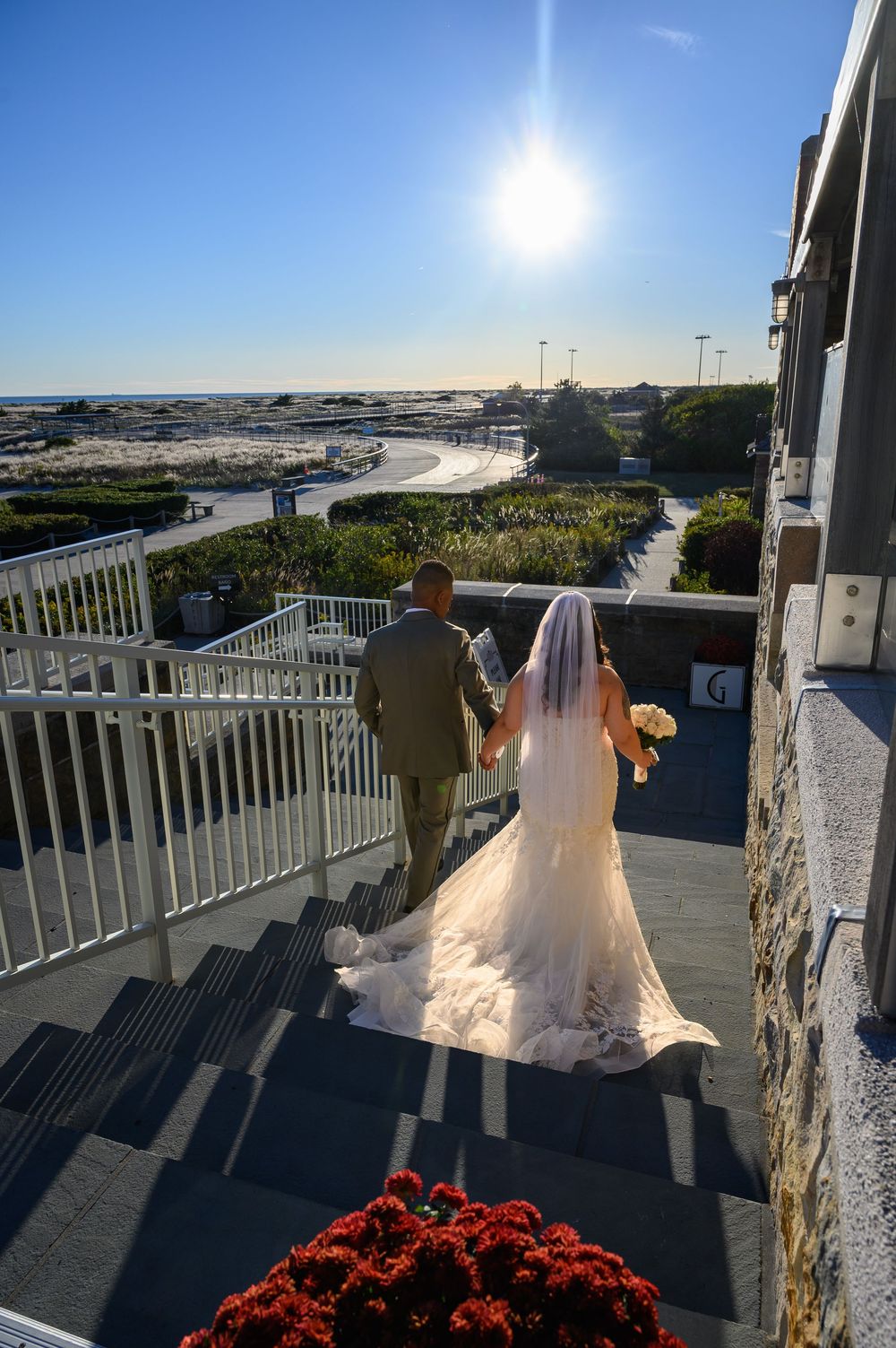 At GatsbyJones Beach, Long Island, with a vintage bride and groom portrait by Deja Vu Studios at sunset.