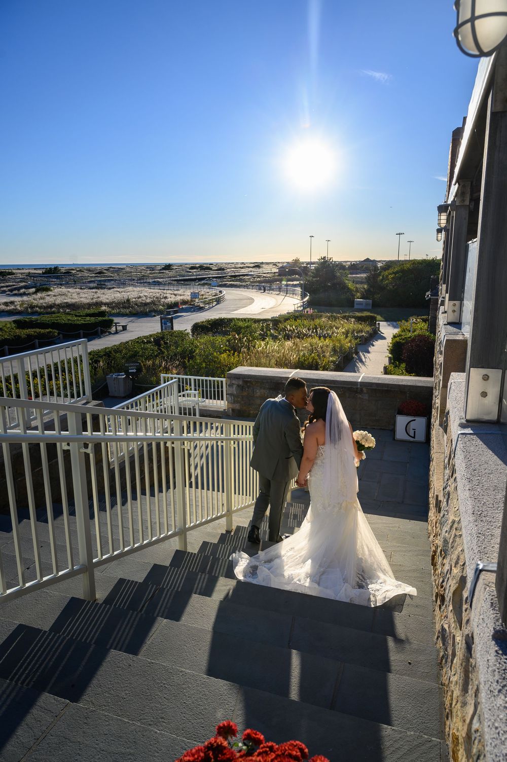 At GatsbyJones Beach, Long Island, with a vintage bride and groom portrait by Deja Vu Studios at sunset.