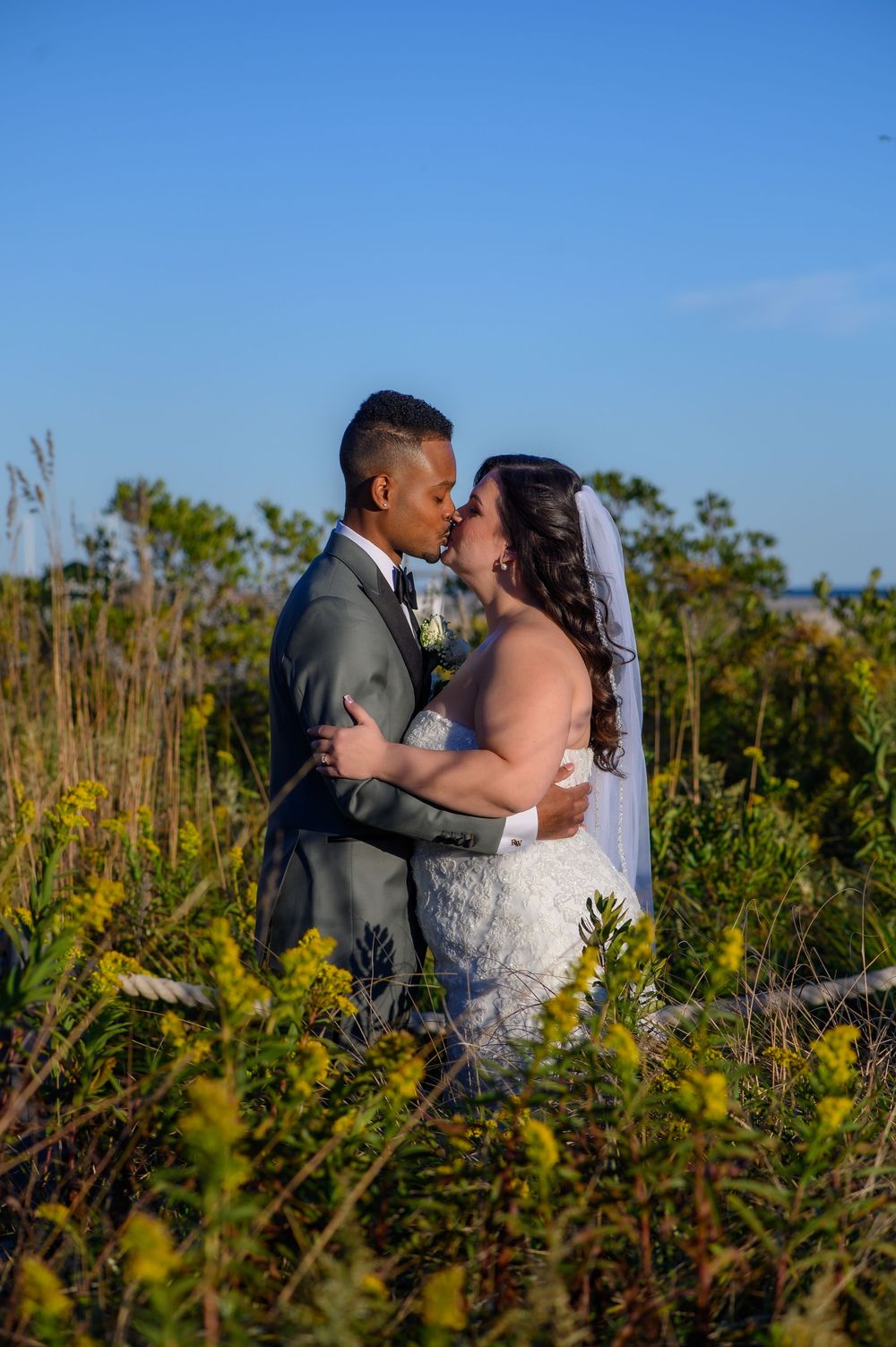 Gatsby-inspired wedding at Jones Beach Long Island by Deja Vu Studios featuring a vintage bride and groom portrait, elegant reception moment