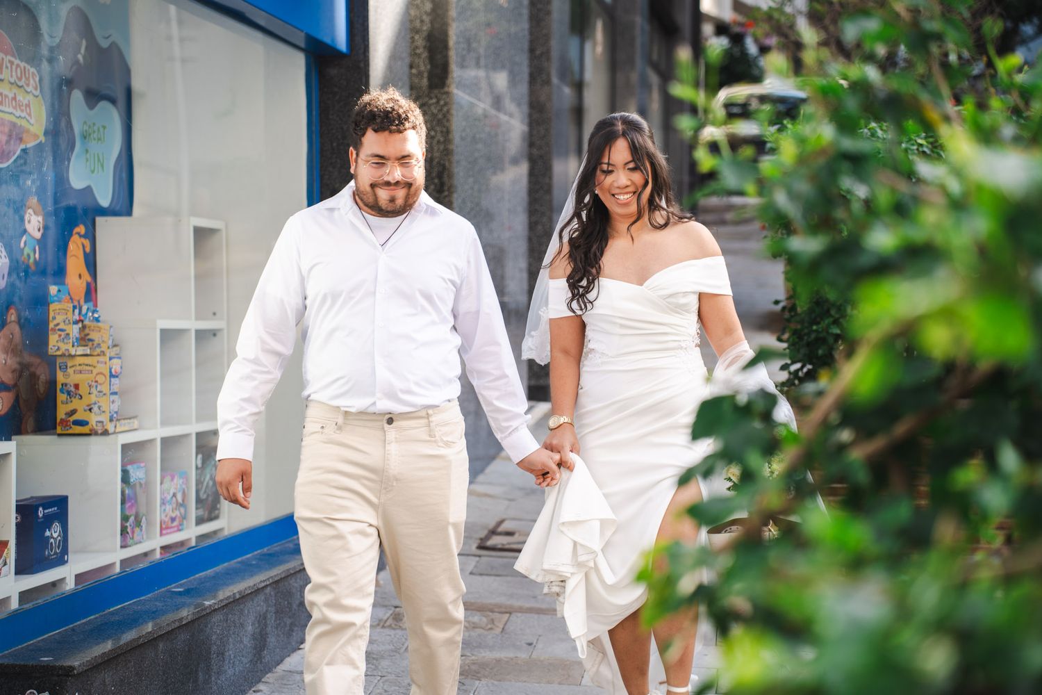Wedding couple smile walking towards Mayors Parlour in Gibraltar for their wedding day