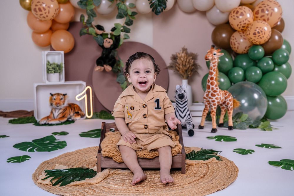 Themed cake smash photography session in New Jersey with colorful and playful setup
