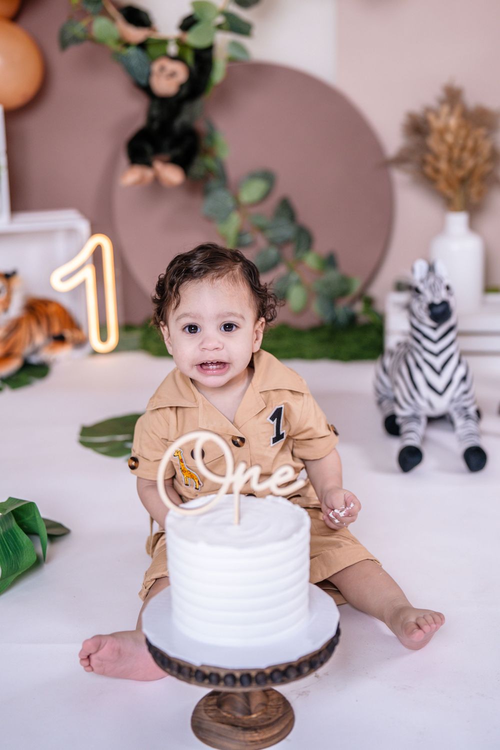Custom cake smash photoshoot in New Jersey with styled backdrop and decorations
