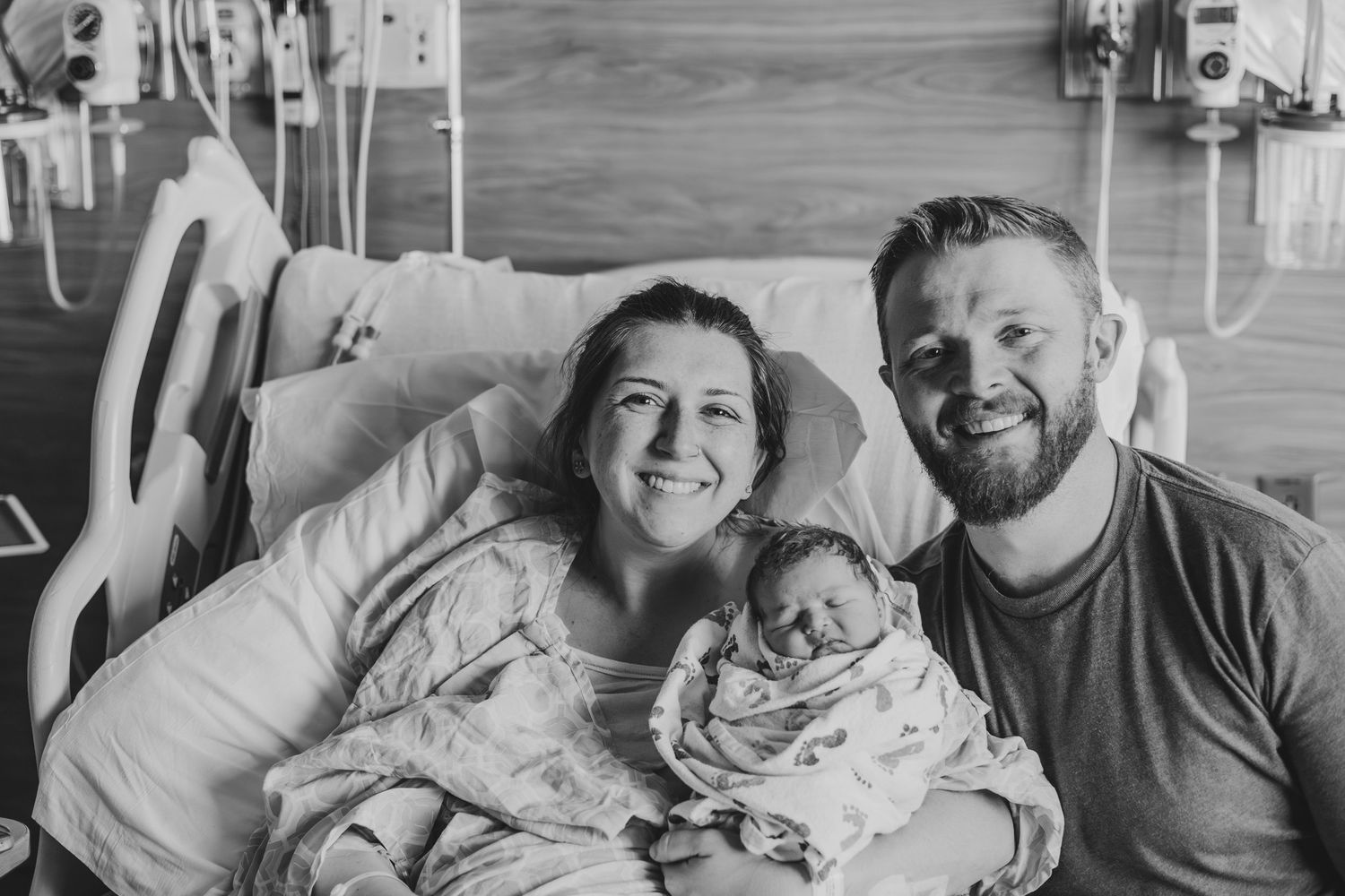 family snuggling together in the hospital | What's Labor Like for Fathers