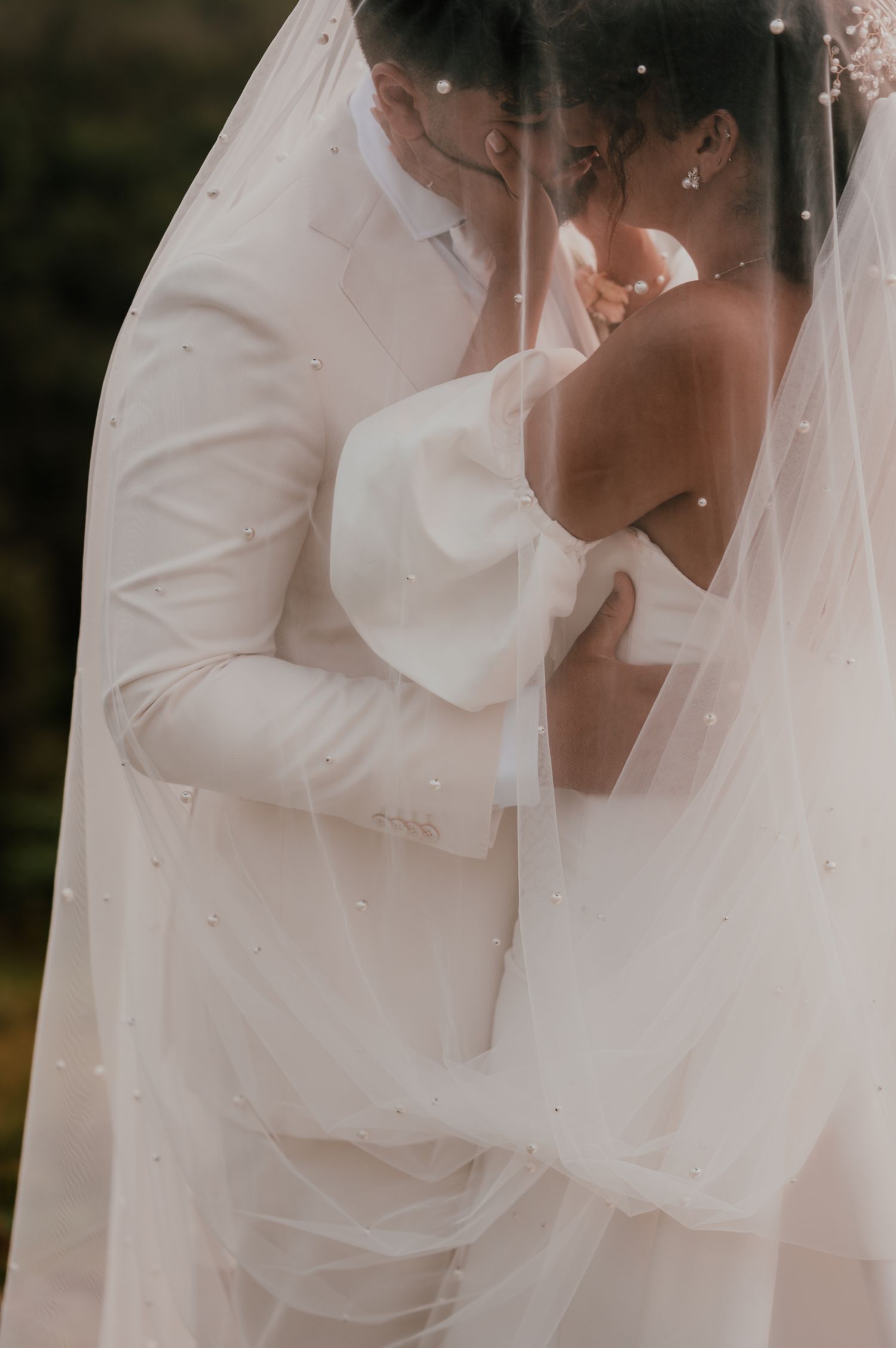A series of romantic wedding photos showing tender moments between a couple in white attire and bridal veil.