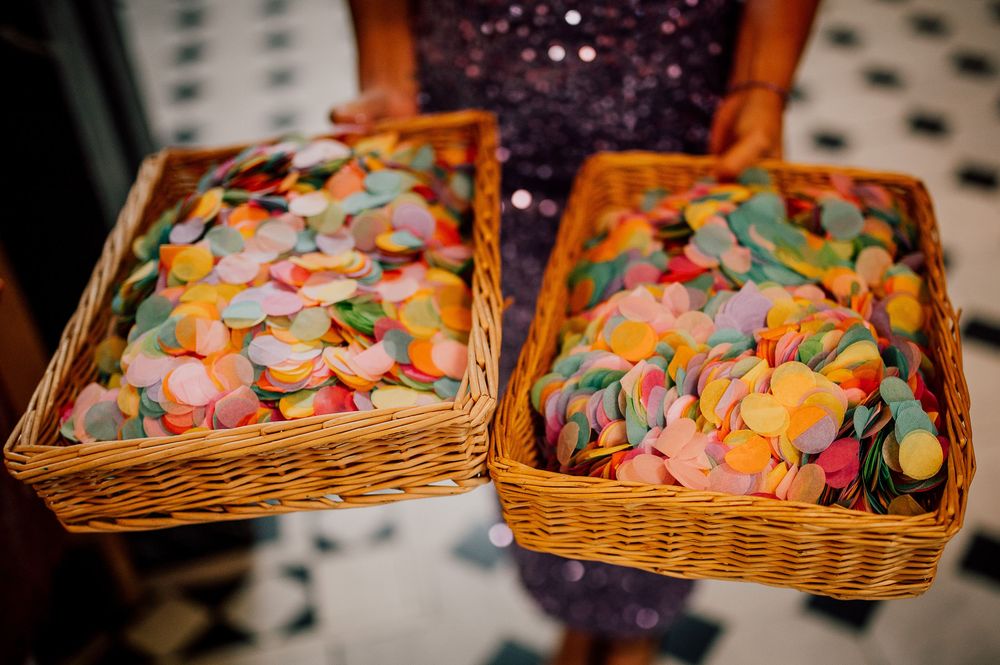 Wicker baskets filled with colorful heart-shaped candy conversation hearts displayed in a row.