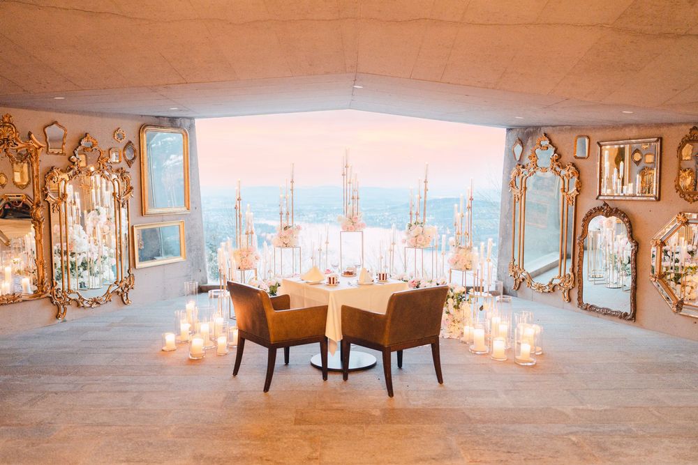 Elegant ballroom interior with crystal chandeliers and mirrored walls creating a romantic atmosphere.