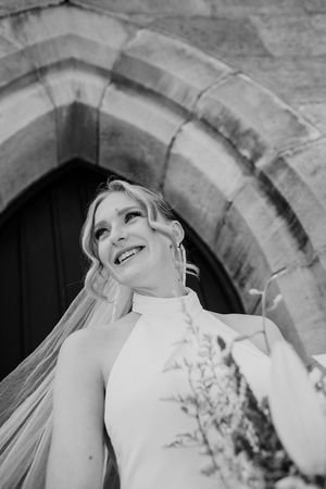 A sequence of artistic black and white bridal portraits showing a person in a wedding dress against stone archways.