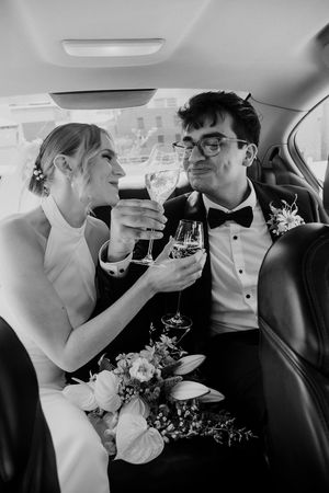Black and white photo sequence showing couple in wedding attire drinking champagne together in car backseat.