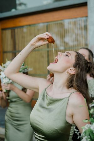 A person in a sage green tank top performs a dramatic eating motion in a series of four sequential photos.