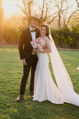 A romantic sunset wedding photo shows a couple embracing on a grassy lawn with warm golden light filtering through trees.