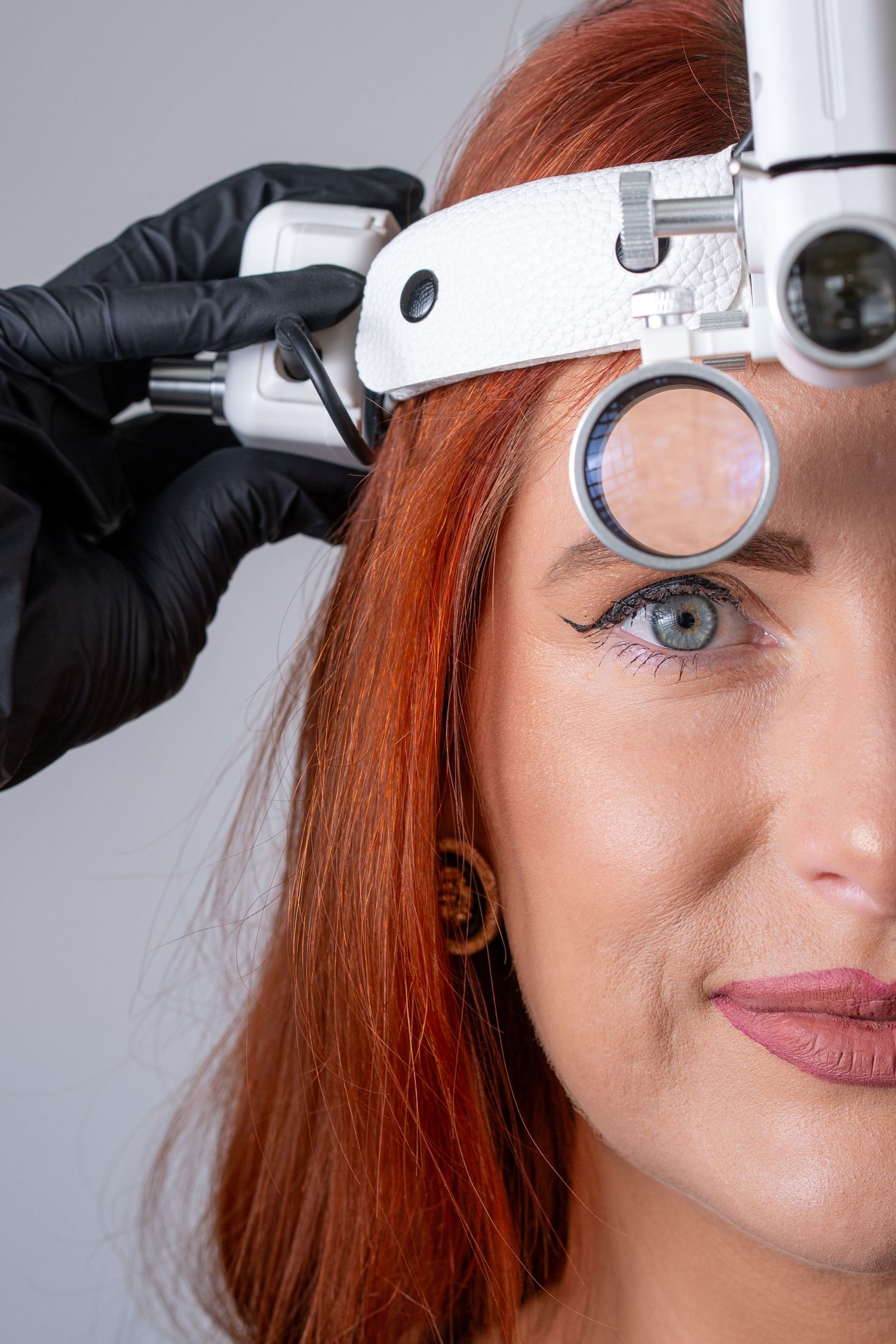 Close-up sequence showing application of professional beauty treatment using white handheld device on skin.