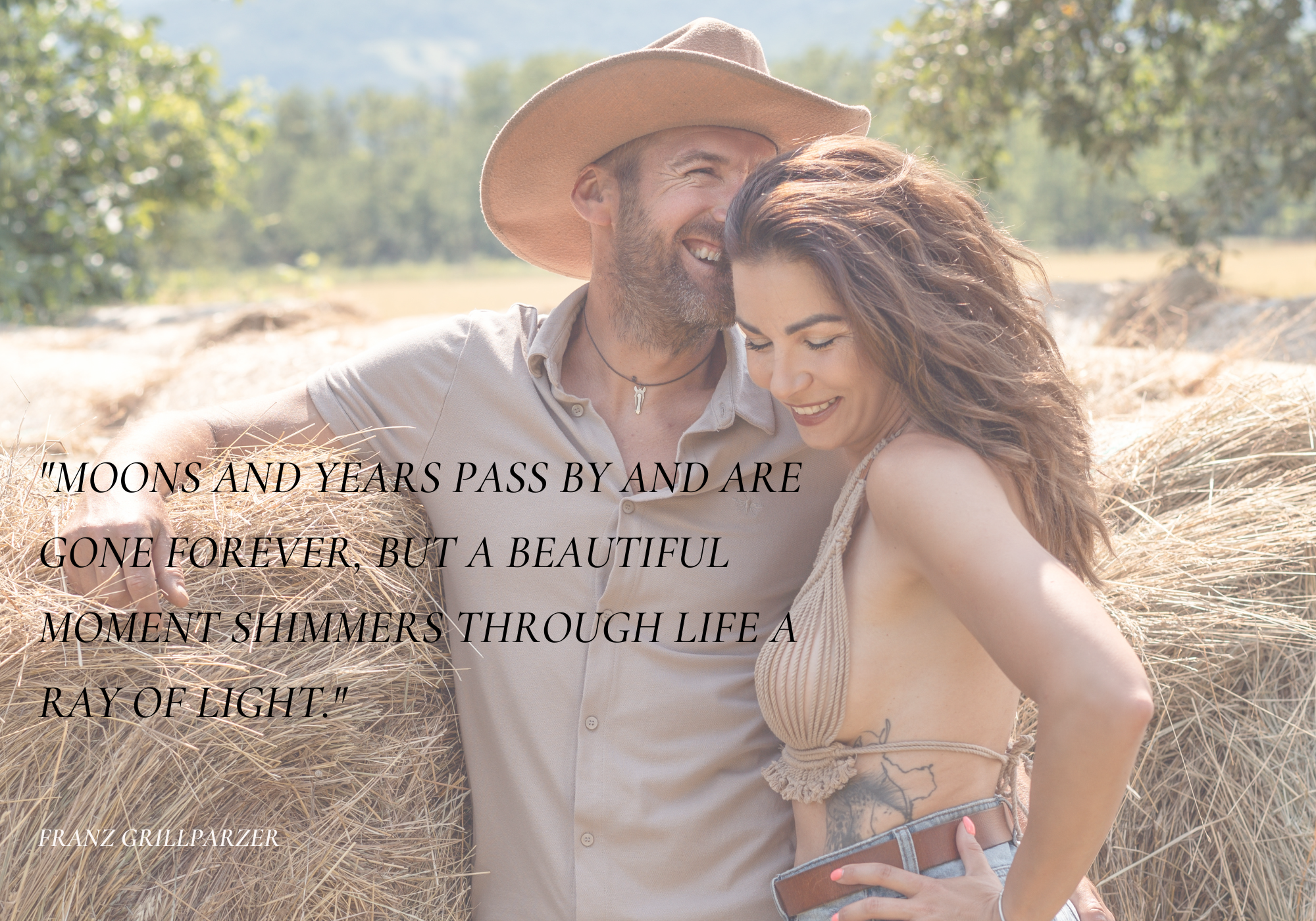 Romantic couple in cowboy hat embraces during golden hour photo session.