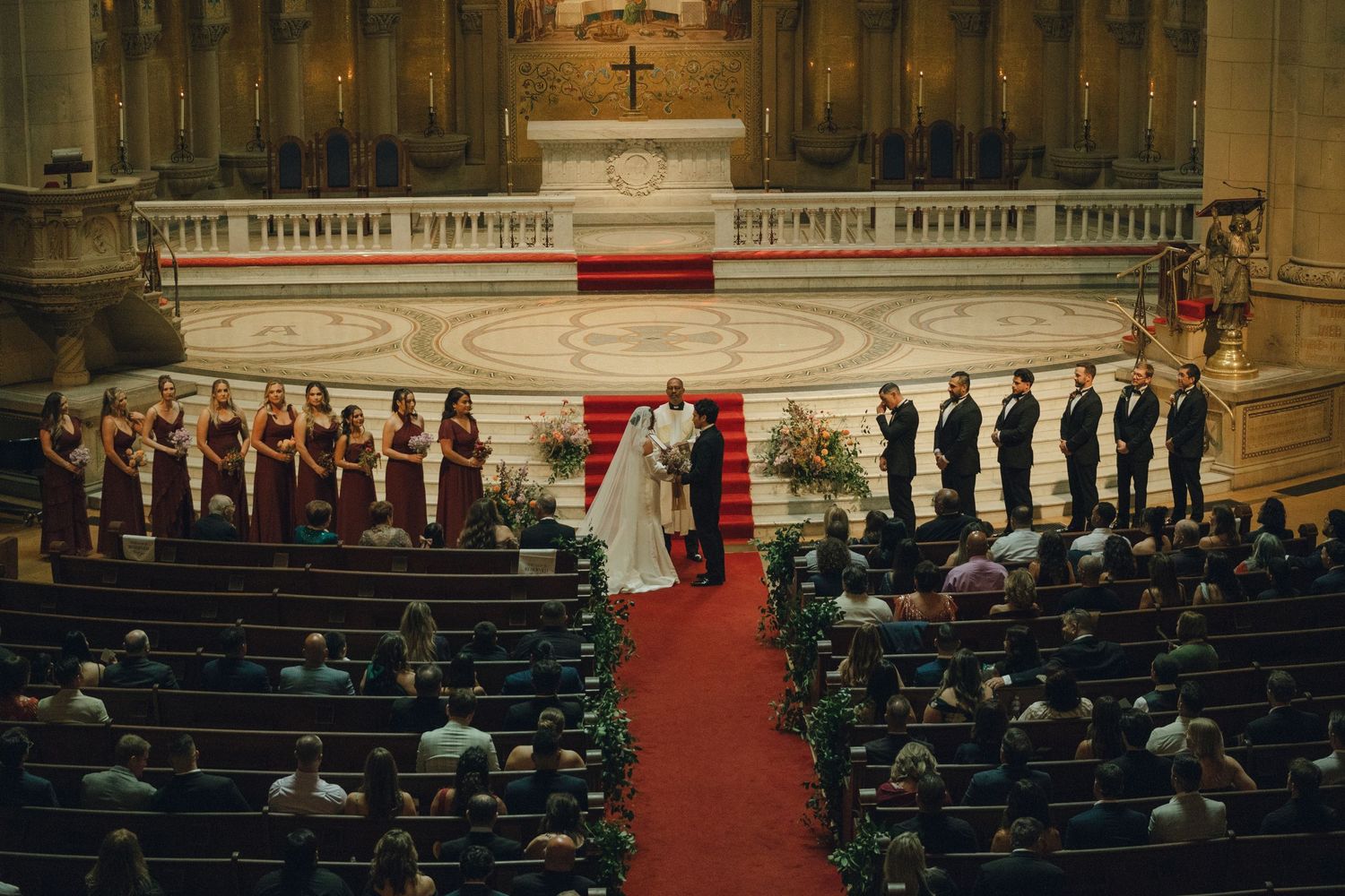 overhead photograph of a wedding dinner in Switzerland, couple leans in to kiss as they celebrate after their wedding ceremony