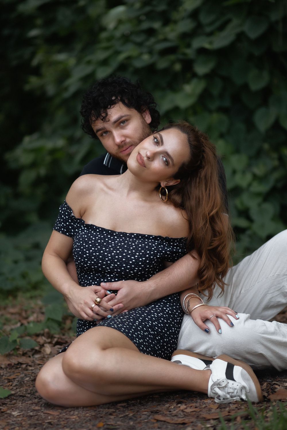 Couple embracing at Kendall Indian Hammocks Park Miami during engagement couples session.