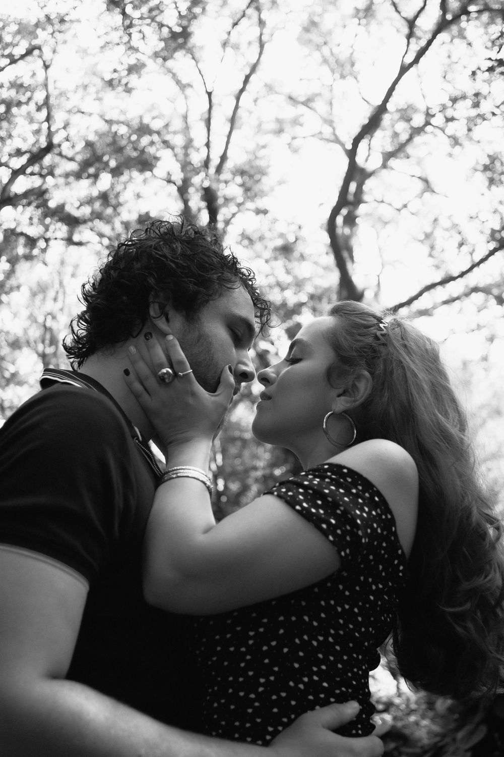 Couple kissing at Kendall Indian Hammocks Park Miami during engagement couples session.