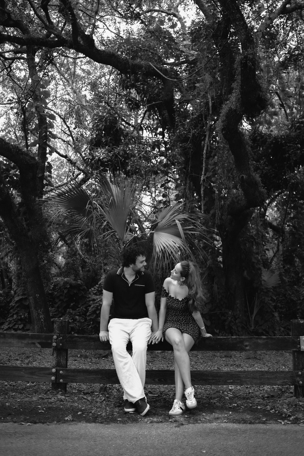 Couple laughing at Kendall Indian Hammocks Park Miami during engagement couples session.
