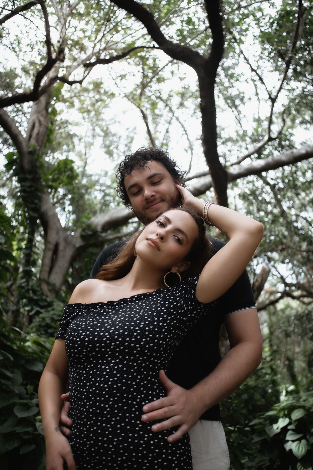 Couple posing at Kendall Indian Hammocks Park Miami during engagement couples session.