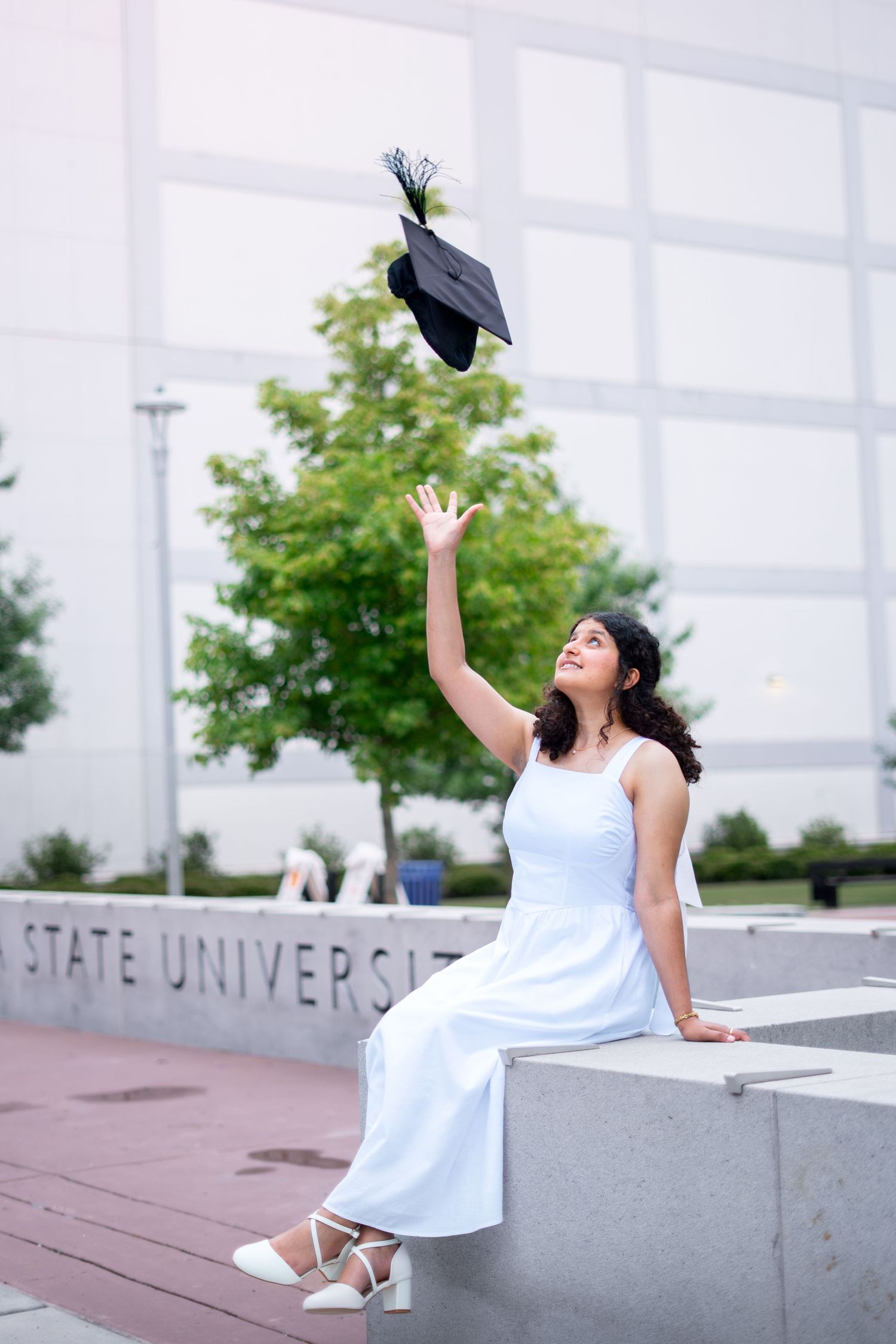 Georgia State graduation group photos in front of the library plaza with GSU sign, one of the best spots on the Atlanta campus