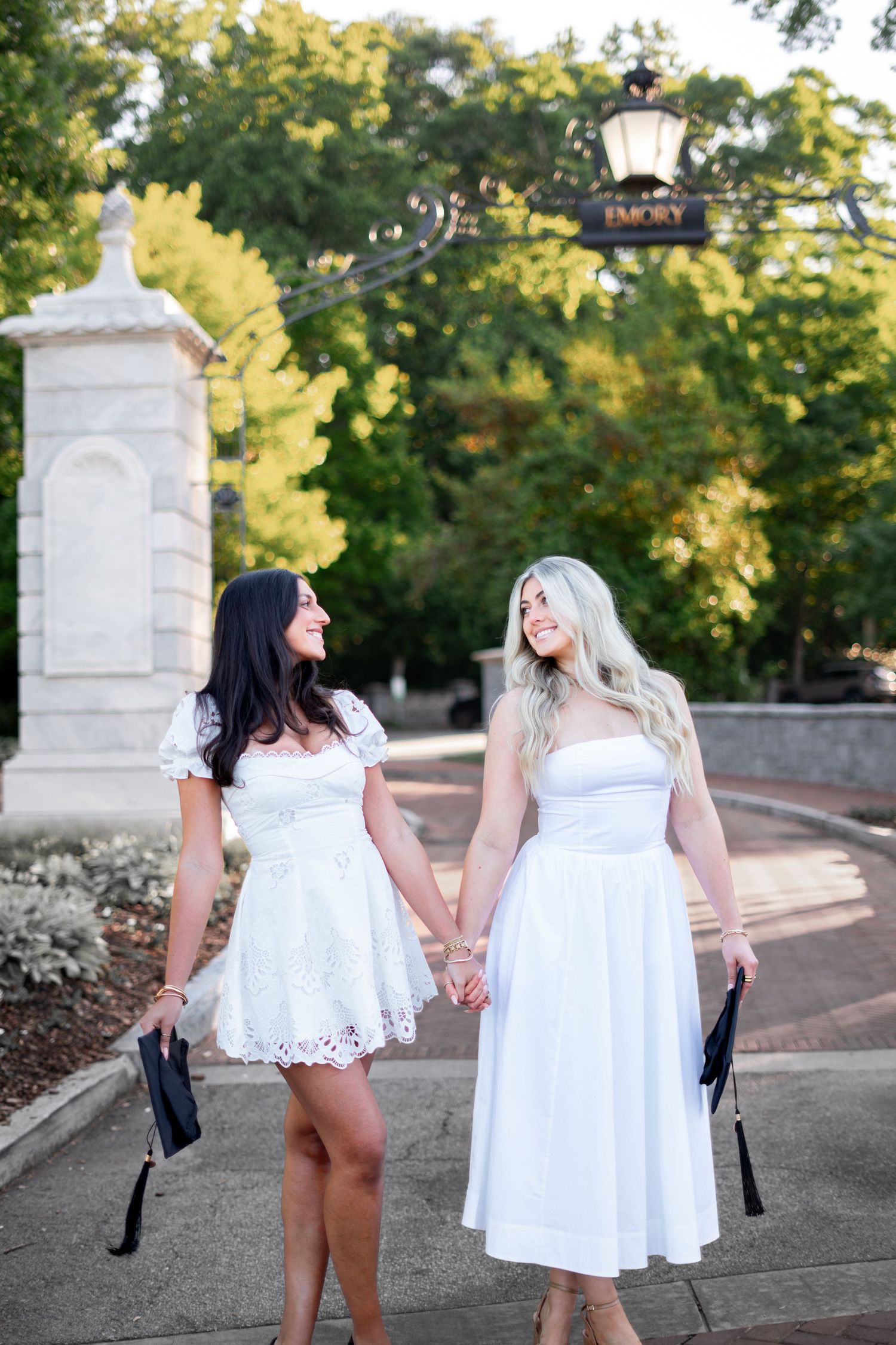 Smiling graduates poses for the best Atlanta grad photos at Emory University with portraits by Pierre The Pear Photography
