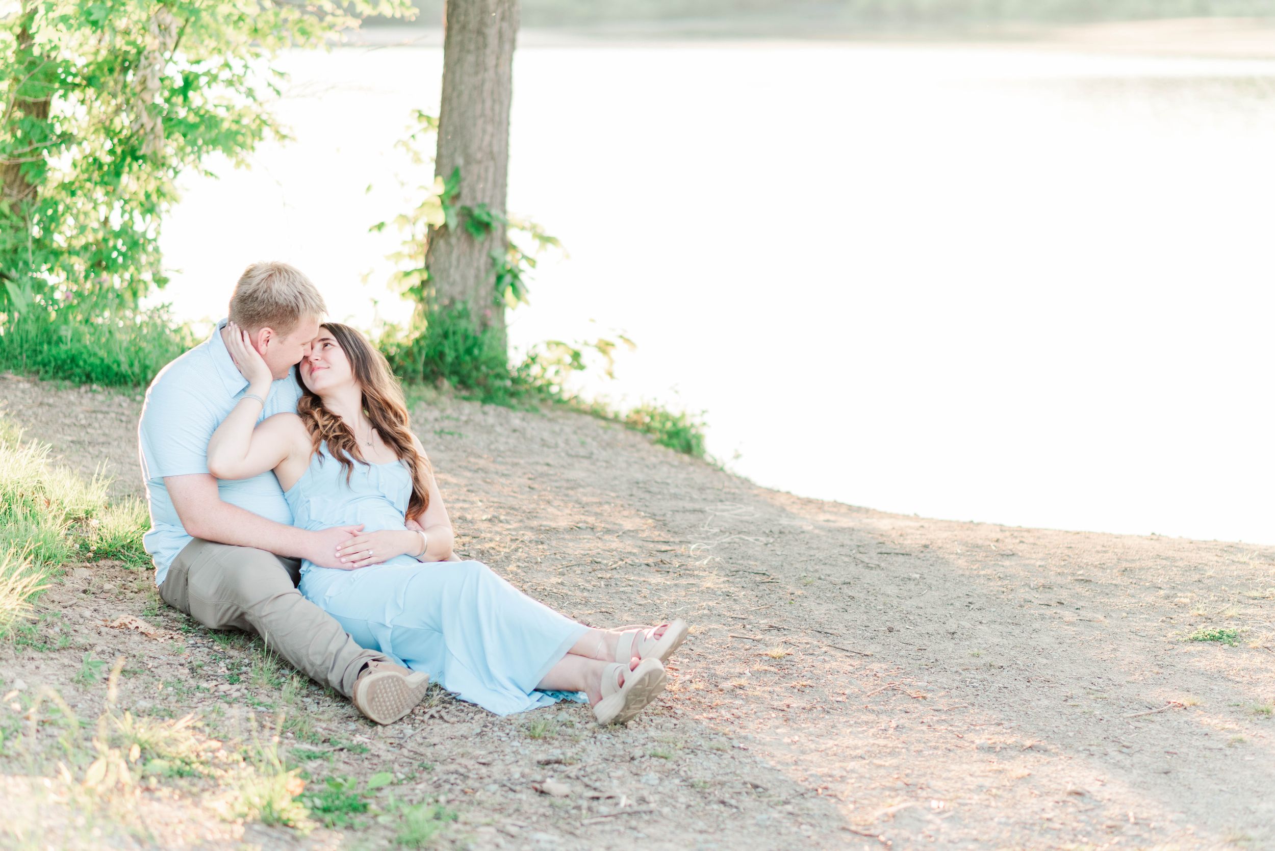 Engagement session at Quemahoning Reservoir in Western Pennsylvania, laying together by the water