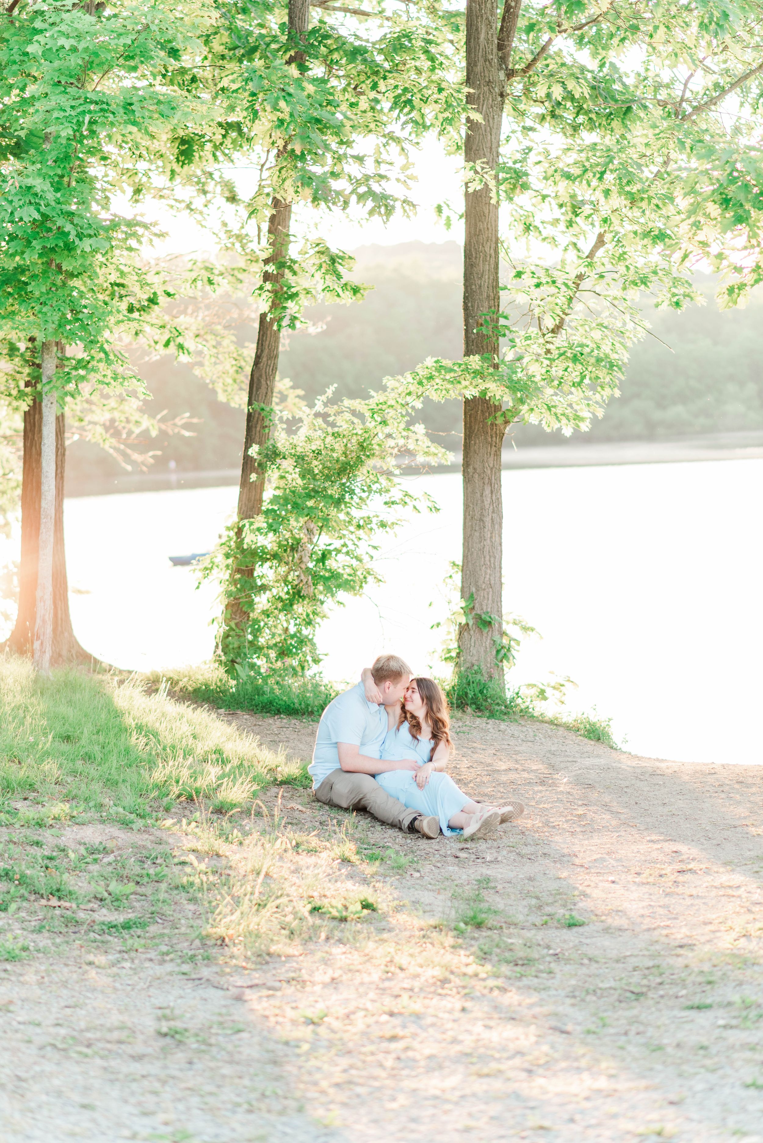 Engagement session at Quemahoning Reservoir in Western Pennsylvania, laying together by the water